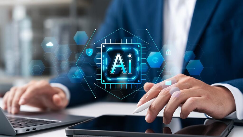 Close-up of a person in a blue blazer working at a desk with a laptop and a digital stylus. A holographic AI circuit icon is centered in front of them, surrounded by hexagonal icons representing cloud computing, security, and data analytics.